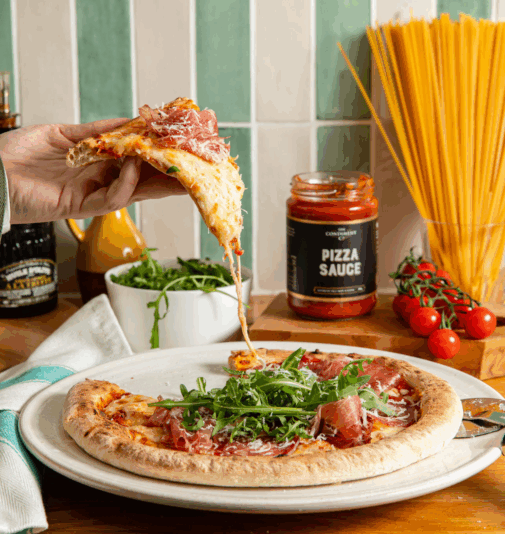 slice of pizza being picked up